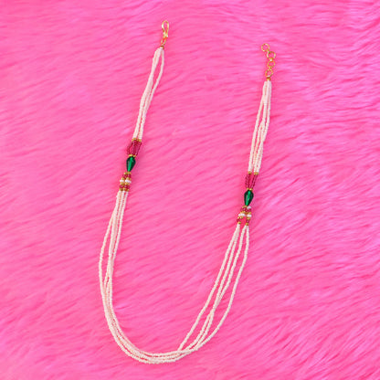 Detailed shot of intricate pearl and colorful bead arrangement