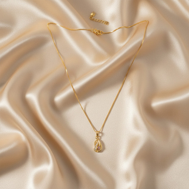 Side view of gold-plated tear-drop pendant necklace with sparkling crystals and pink stone