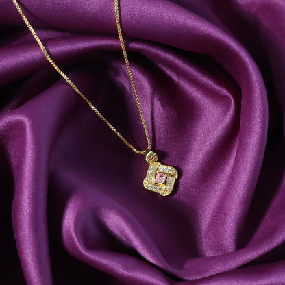 Square pendant necklace featuring a radiant pink stone center with sparkling crystals