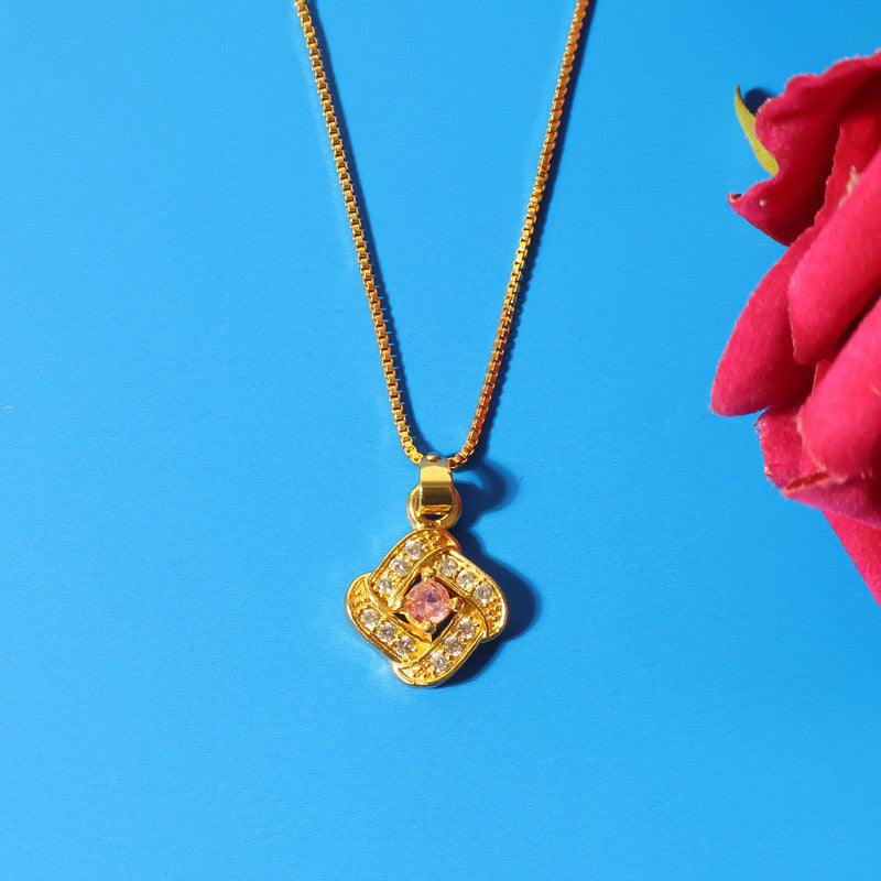 Refined pendant necklace showcasing radiant pink stone at its center and golden finish