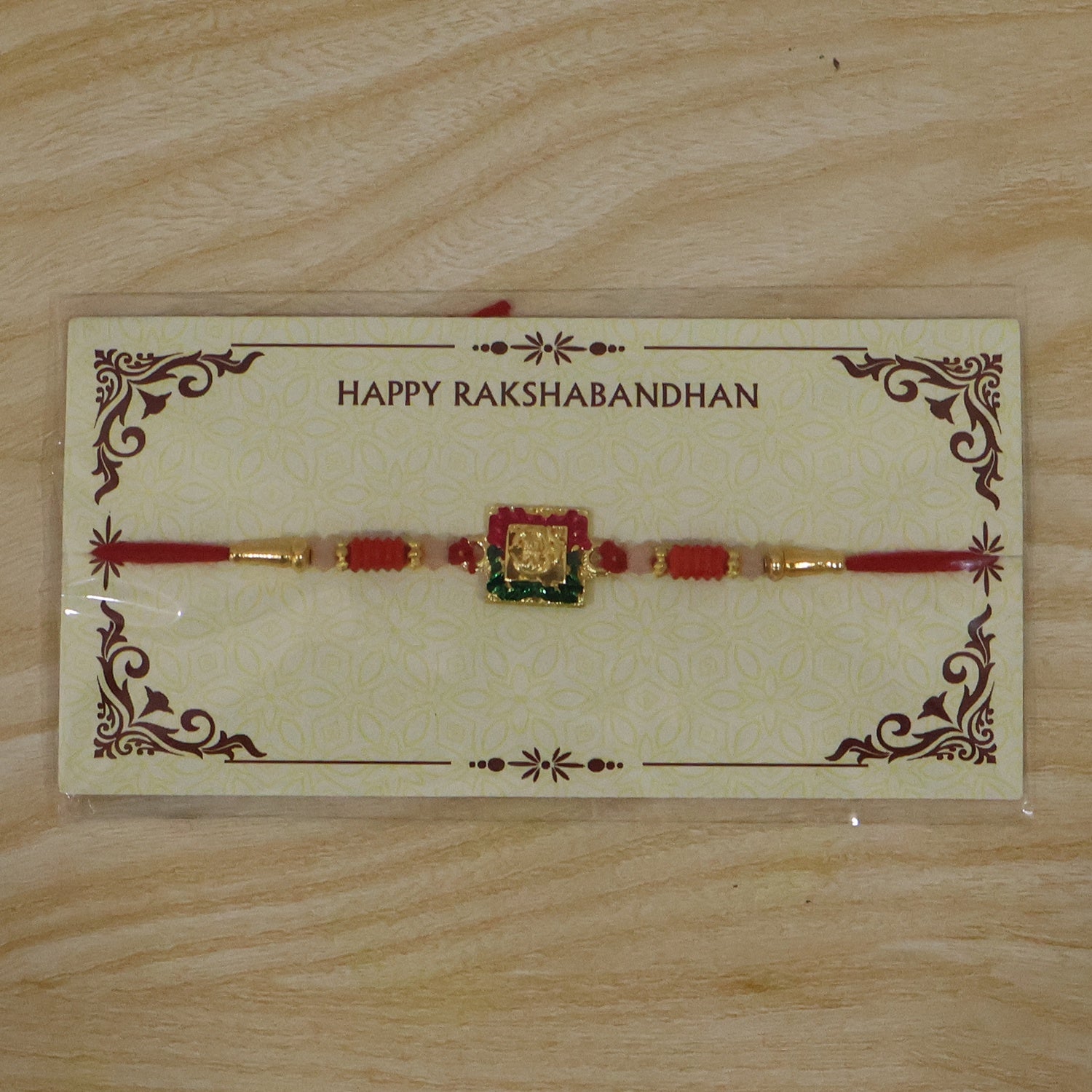 Close shot of decorative elements on Lord Ganesha rakhi