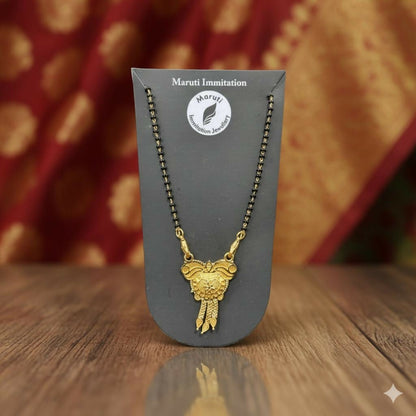 CZ-studded heart with a couple silhouette, this pendant is cast in gold-toned imitation metal to celebrate the sacred bond of marriage.