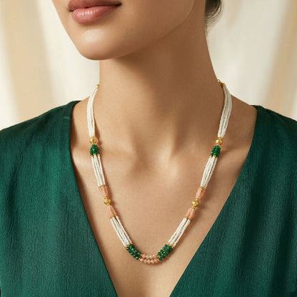 Pearl-like beads with gold-tone detailing on mala necklace