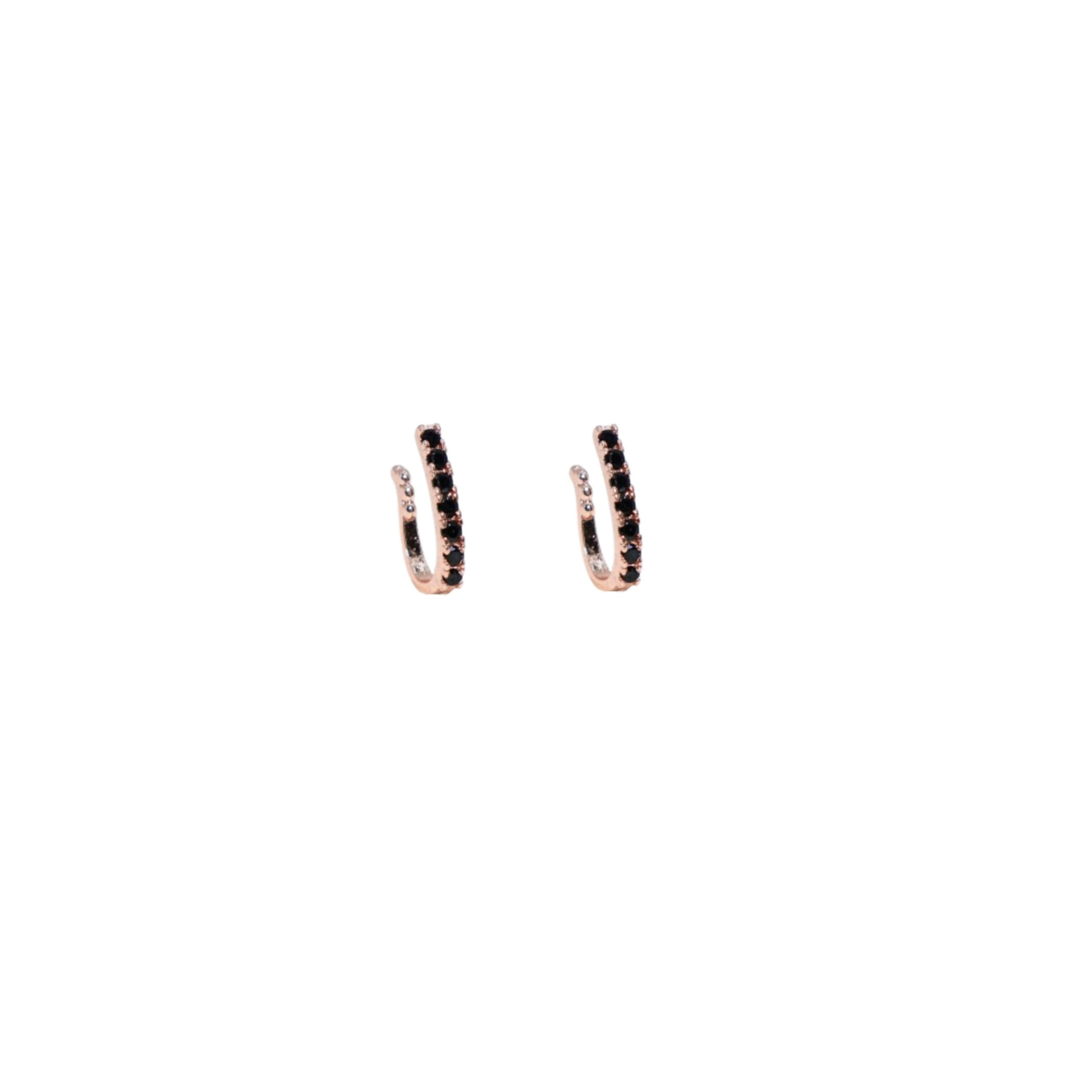 Close-up view of dual row cubic zirconia nose ring in rose gold finish with pink stones