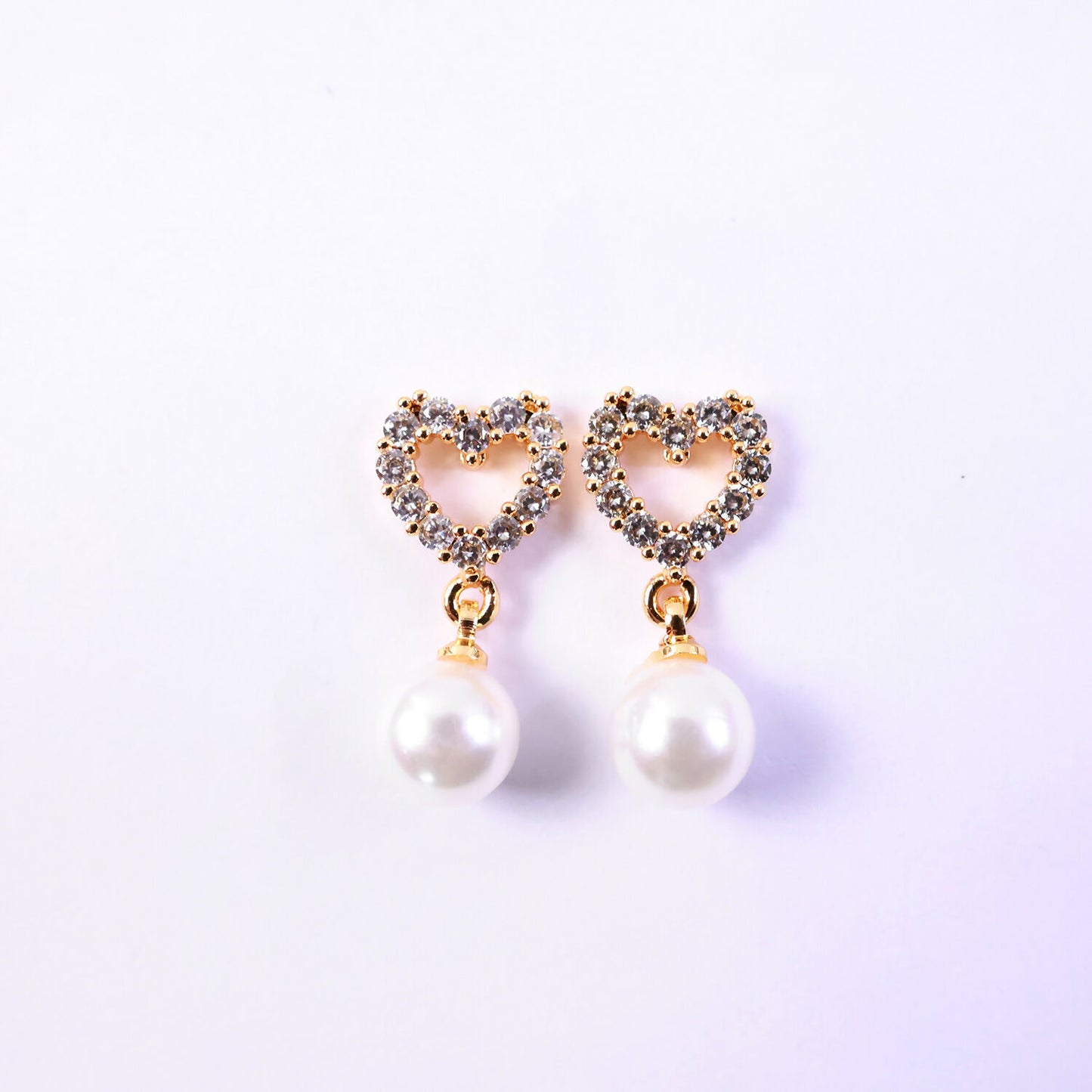 Stylish heart shape pearl earrings suitable for festive and party wear occasions