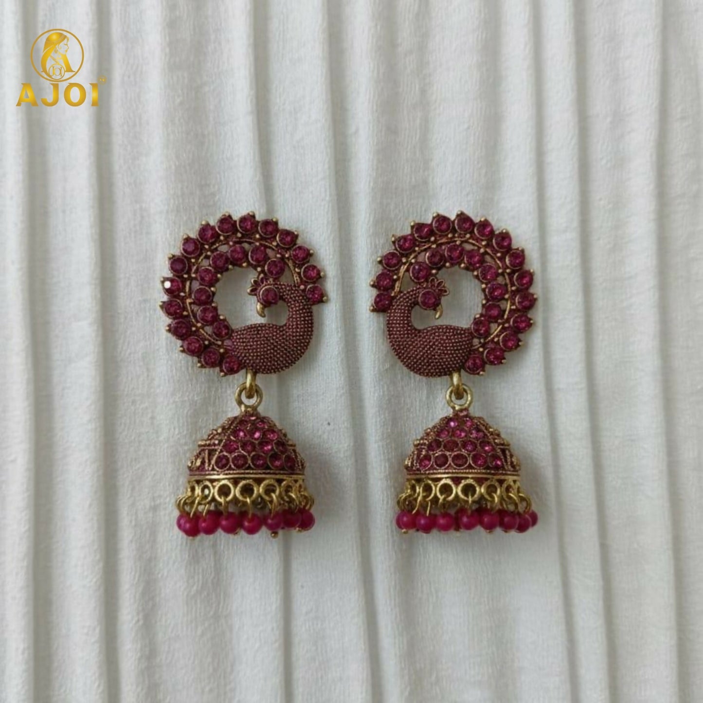 Peacock Motif Ruby-Tone Jhumka Earrings in Antique Gold Finish