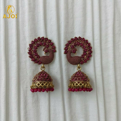 Peacock Motif Ruby-Tone Jhumka Earrings in Antique Gold Finish