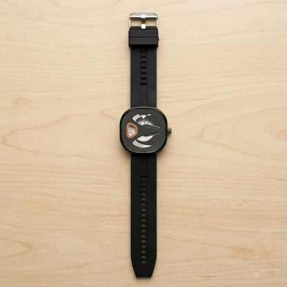 Modern square dial watch on a dark surface from above