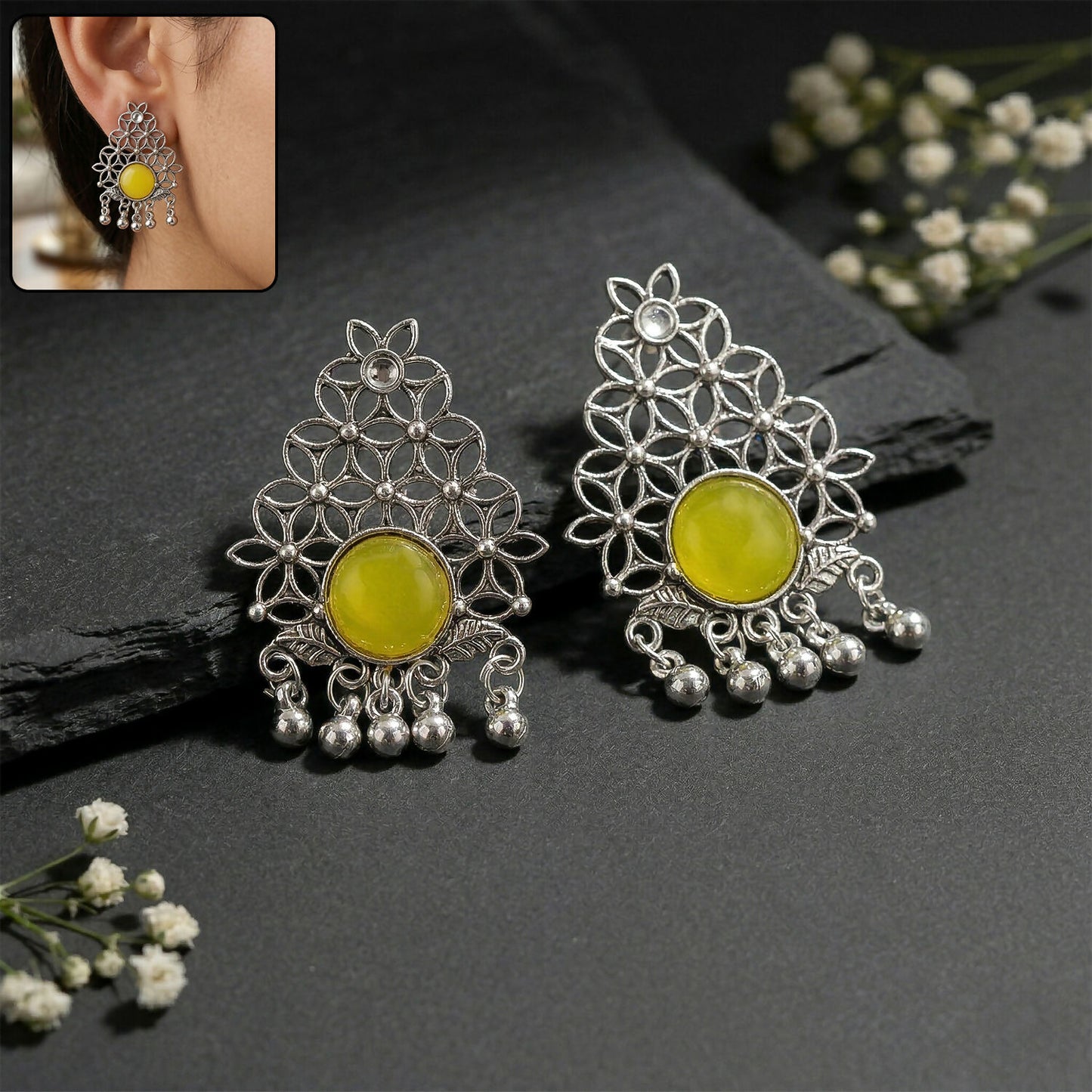Oxidized silver filigree earrings with yellow center stone and ghungroo dangles