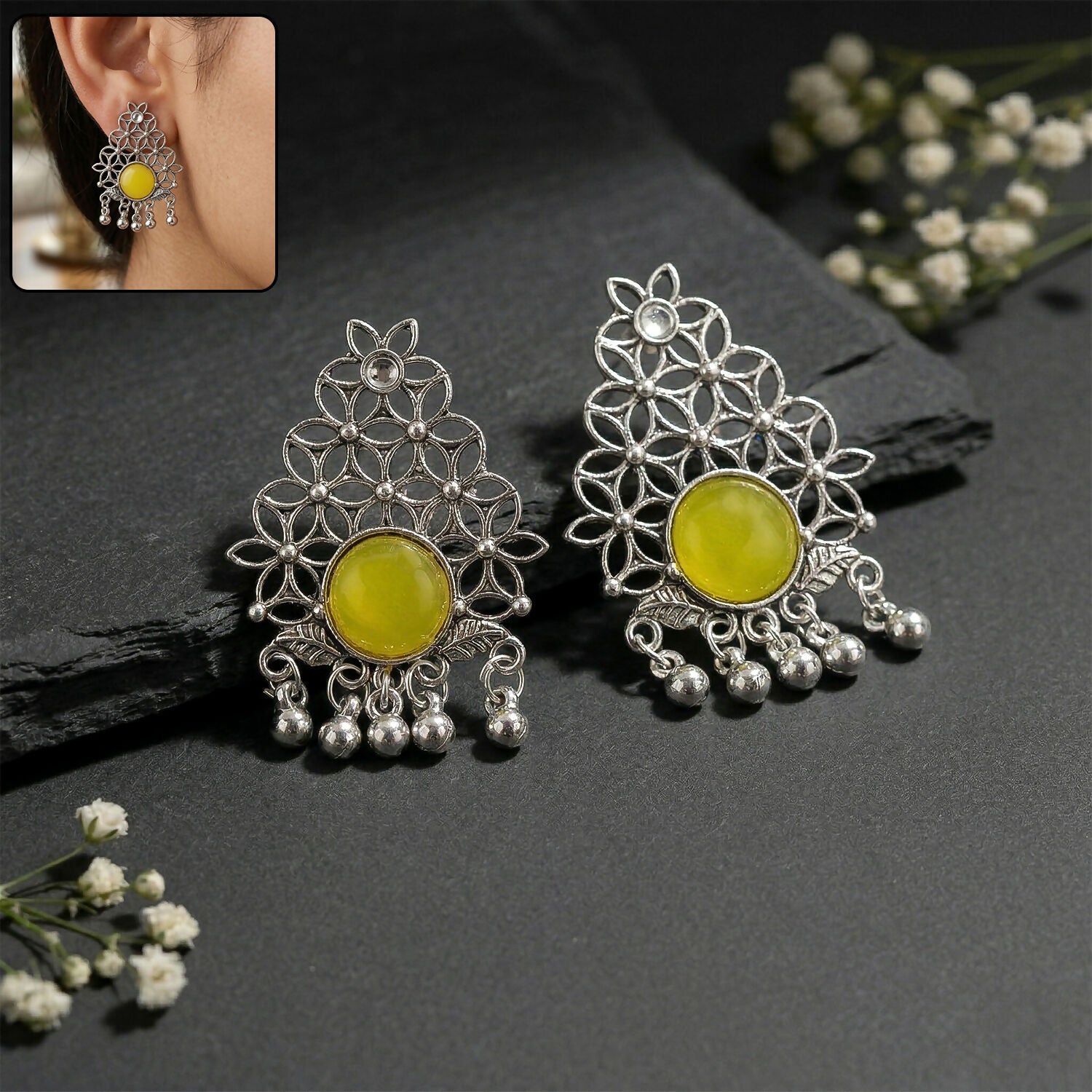 Oxidized silver filigree earrings with yellow center stone and ghungroo dangles