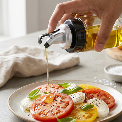 Kitchen setup with clear oil and vinegar dispenser on the counter.