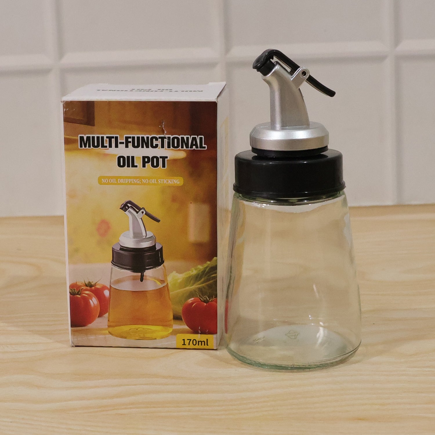 Kitchen essentials: glass oil dispenser bottle with no-drip spout.