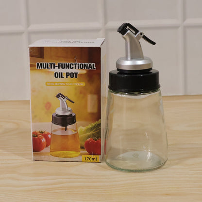 Kitchen essentials: glass oil dispenser bottle with no-drip spout.