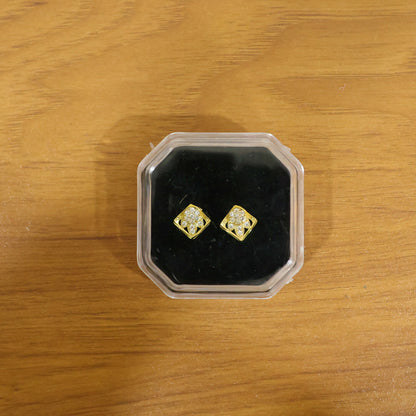 Elegant gold stud earrings with floral and stone design, suitable for everyday wear