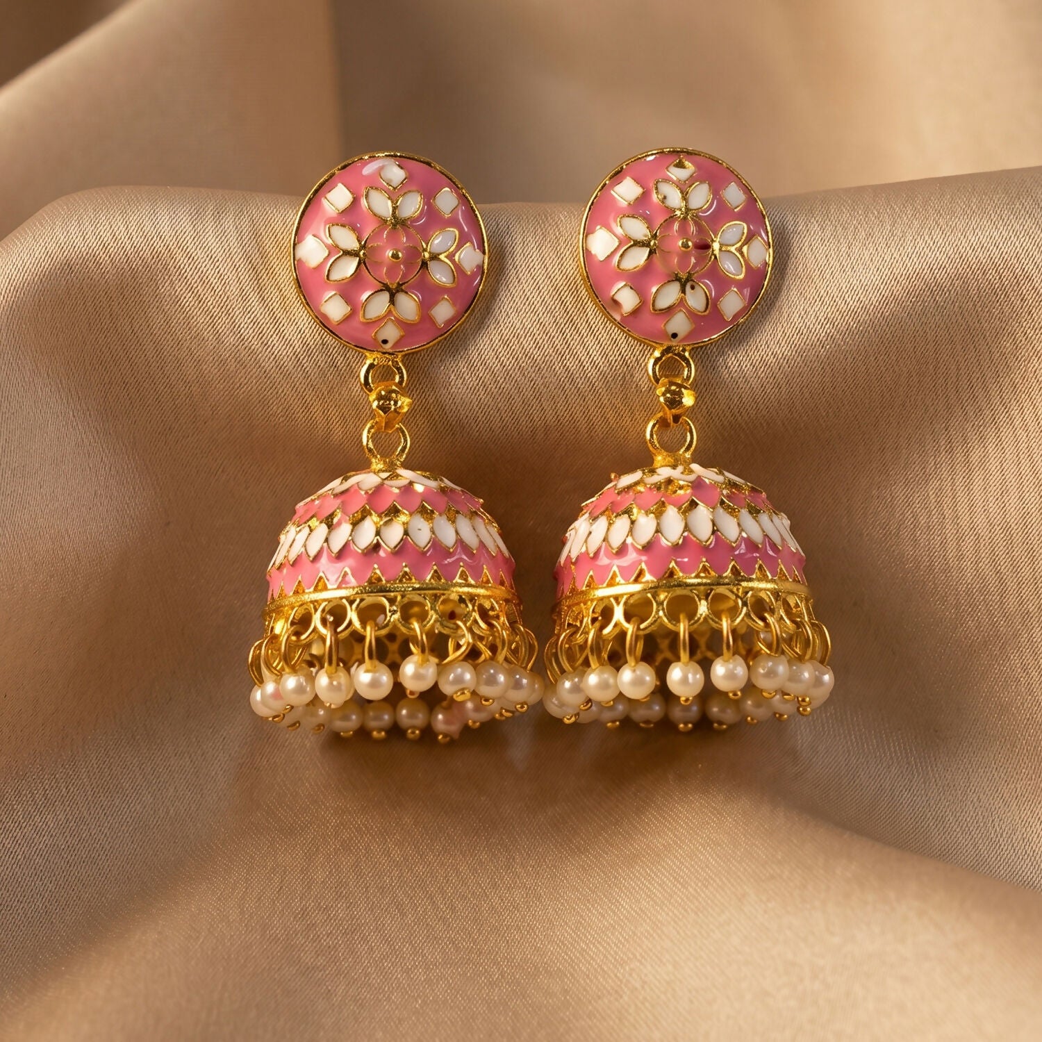Pink jhumka earrings styled with festive attire