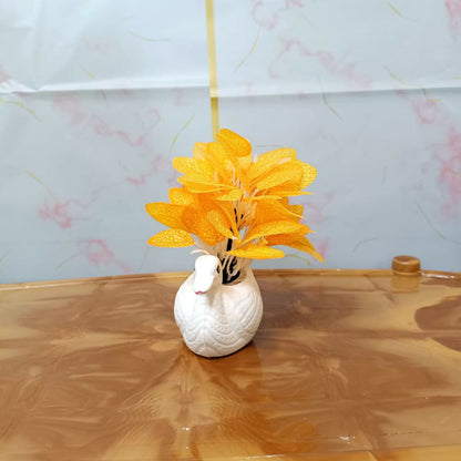 Elegant white ceramic swan vase with orange artificial skeleton leaves for home decor