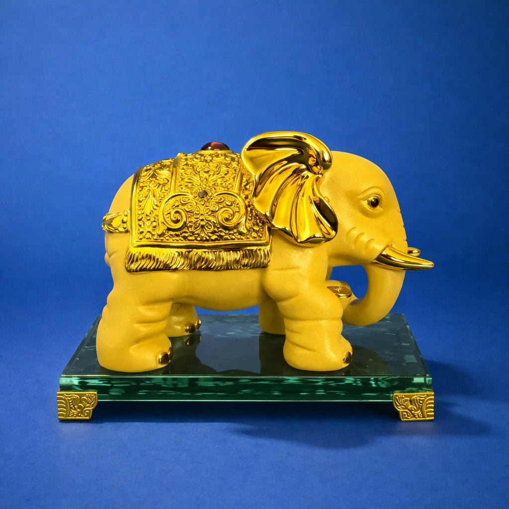 Golden elephant showpiece placed on a decorative shelf