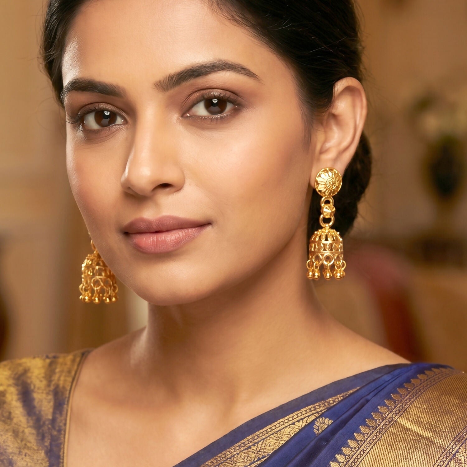 Elegant gold-plated jhumka earrings with dangling pearls