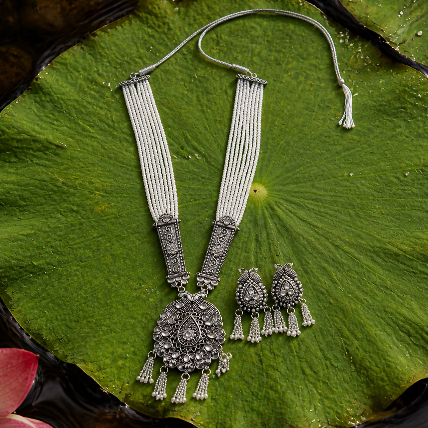 Traditional pearl necklace with designer pendant and matching earrings