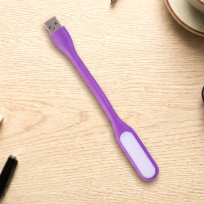 Flexible USB LED light positioned over laptop keyboard