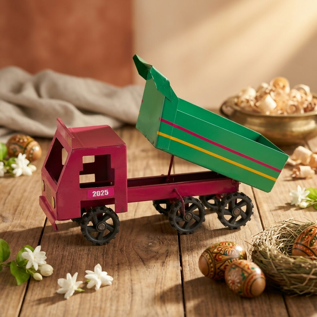 Close-up of the rugged wheels on metal dumper truck toy