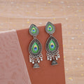 Peacock Feather Drop Jhumka Earrings – Elegant Silver Finish