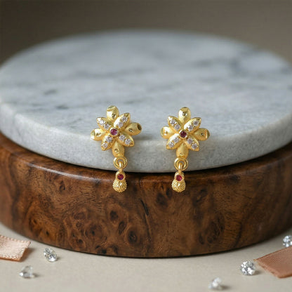 Fashionable gold plated drop earrings with intricate floral detailing.