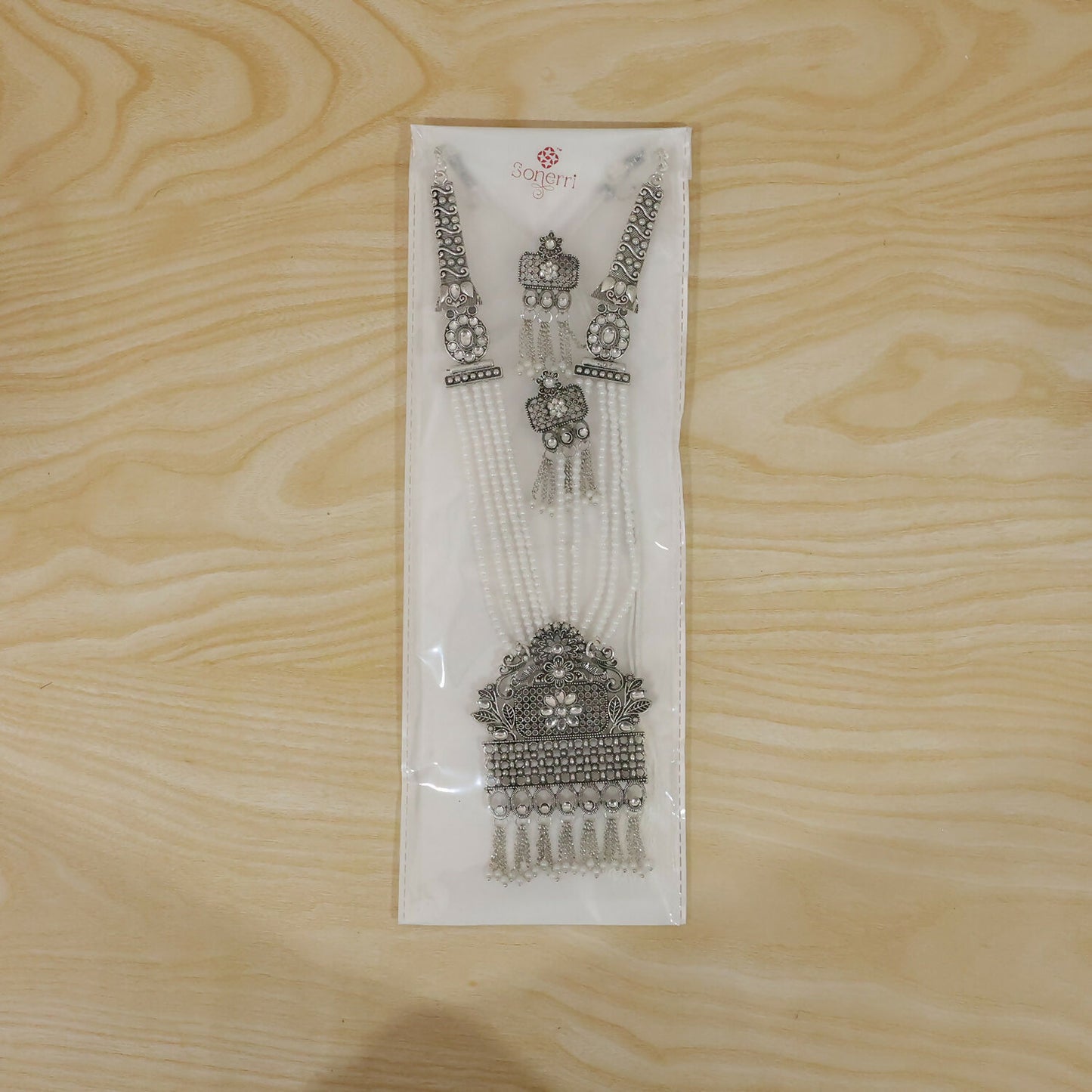 Gold-plated necklace set laid flat for display