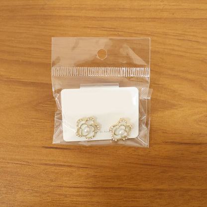 Elegant drop earrings showcasing crystal and pearl design