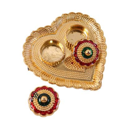 Compact and decorative golden kumkum holder for daily puja accessories