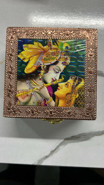 Upright view of copper-finished wooden jewelry box with intricate details