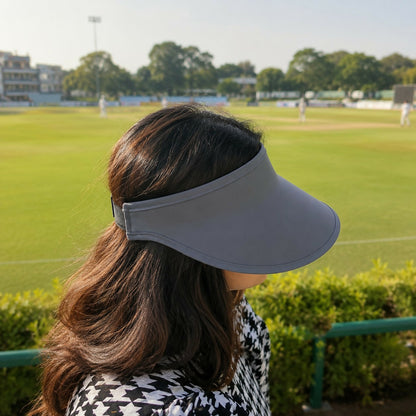 Women’s sun visor cap shown in outdoor sports use
