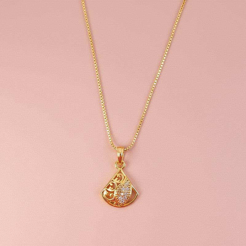 Artistic gold plated pendant necklace with detailed cutwork and leaf accent