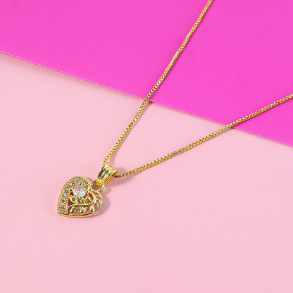 Elegant Crystal Heart Pendant Necklace with Artistic Leaf Detailing