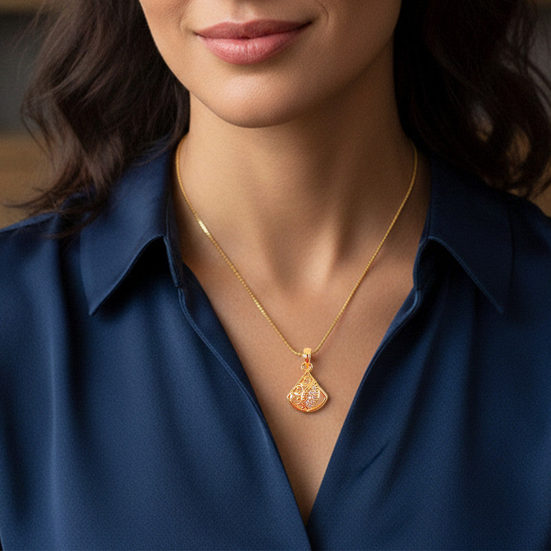 Gold plated pendant necklace showing intricate cutwork and sparkling leaf accent