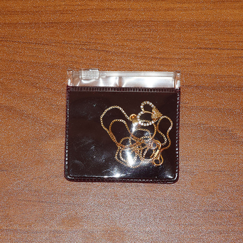 Crystal accented double heart pendant necklace with textured inner heart and shining gold plating