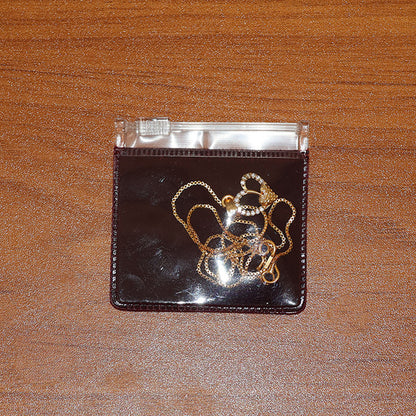 Crystal accented double heart pendant necklace with textured inner heart and shining gold plating