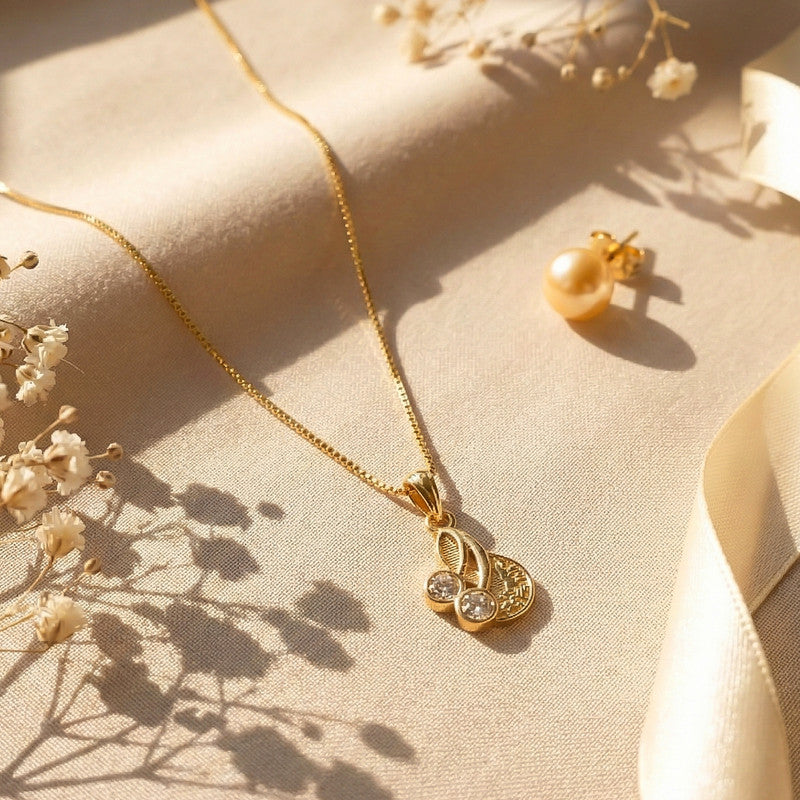Elegant Gold Pendant Necklace with Dual Crystal Charms and Textured Disc