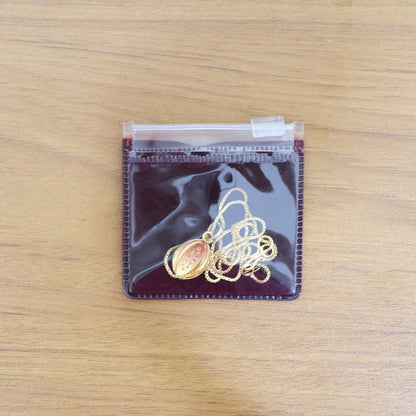 Gold-Plated Teardrop Pendant Necklace with Intricate Stone Detailing