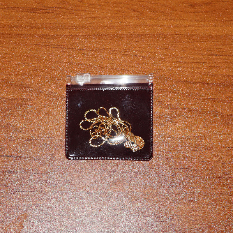 Elegant Gold Pendant Necklace with Dual Crystal Charms and Textured Disc