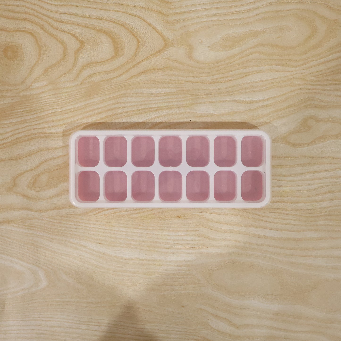 Live image of pink ice cube tray in use