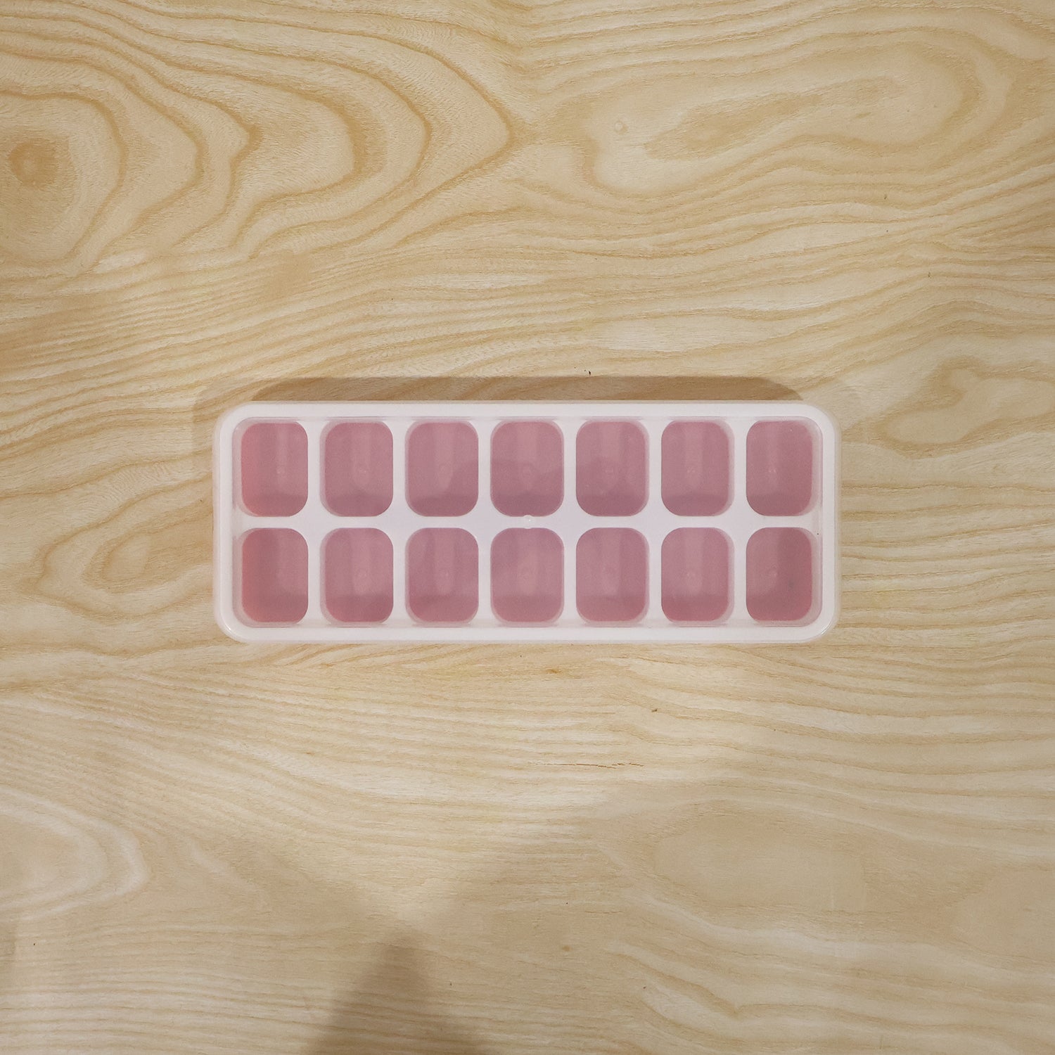Live image of pink ice cube tray in use