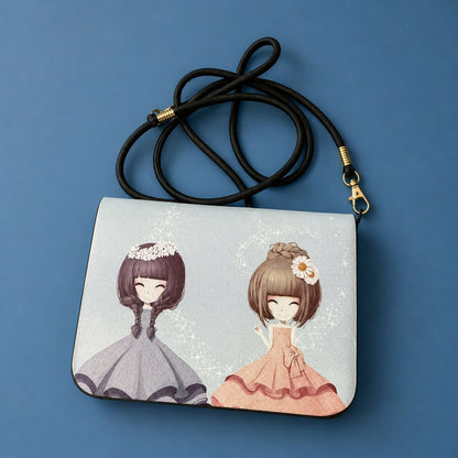 Girls blue sling bag with magnetic flap closure