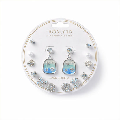 Close-up of silver-plated Korean style stud earrings in the combo set