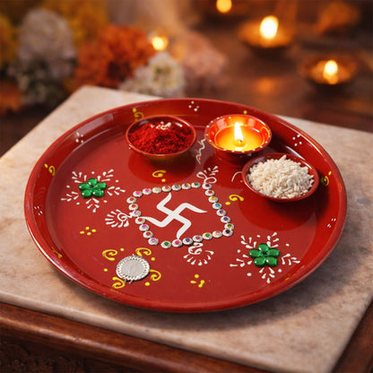 Festive pooja thali showcasing intricate hand-painted designs and stones