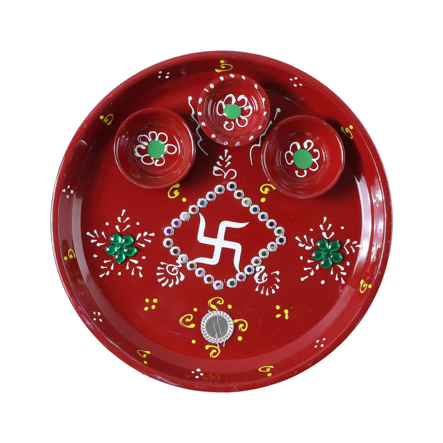 Three diyas arranged on hand-painted pooja thali