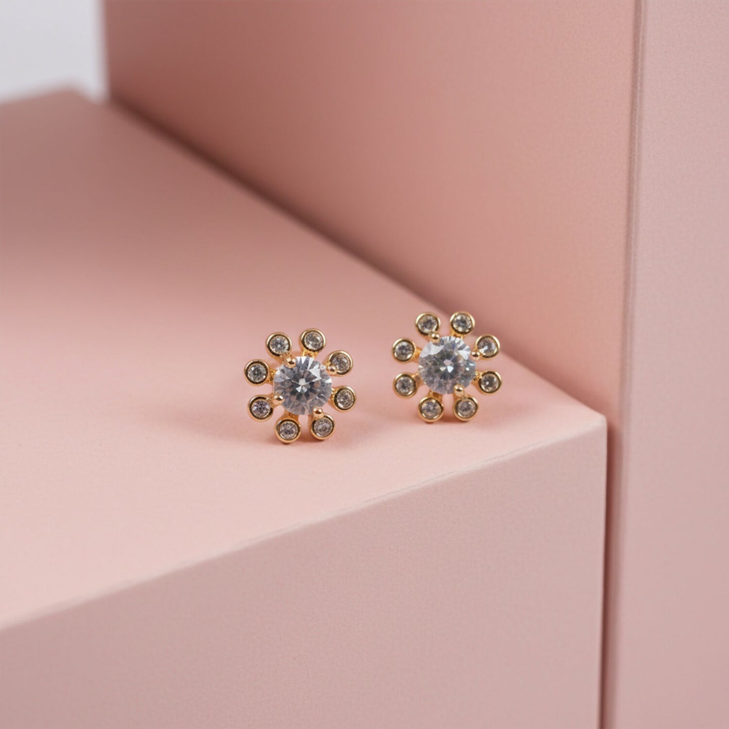 Close-up of flower design stone stud earrings highlighting central and surrounding stones