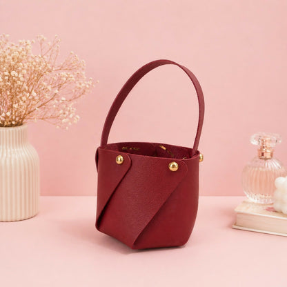 Side angle of maroon mini handheld storage basket