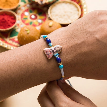 Side view of decorative beads and stylish Rakhi thread