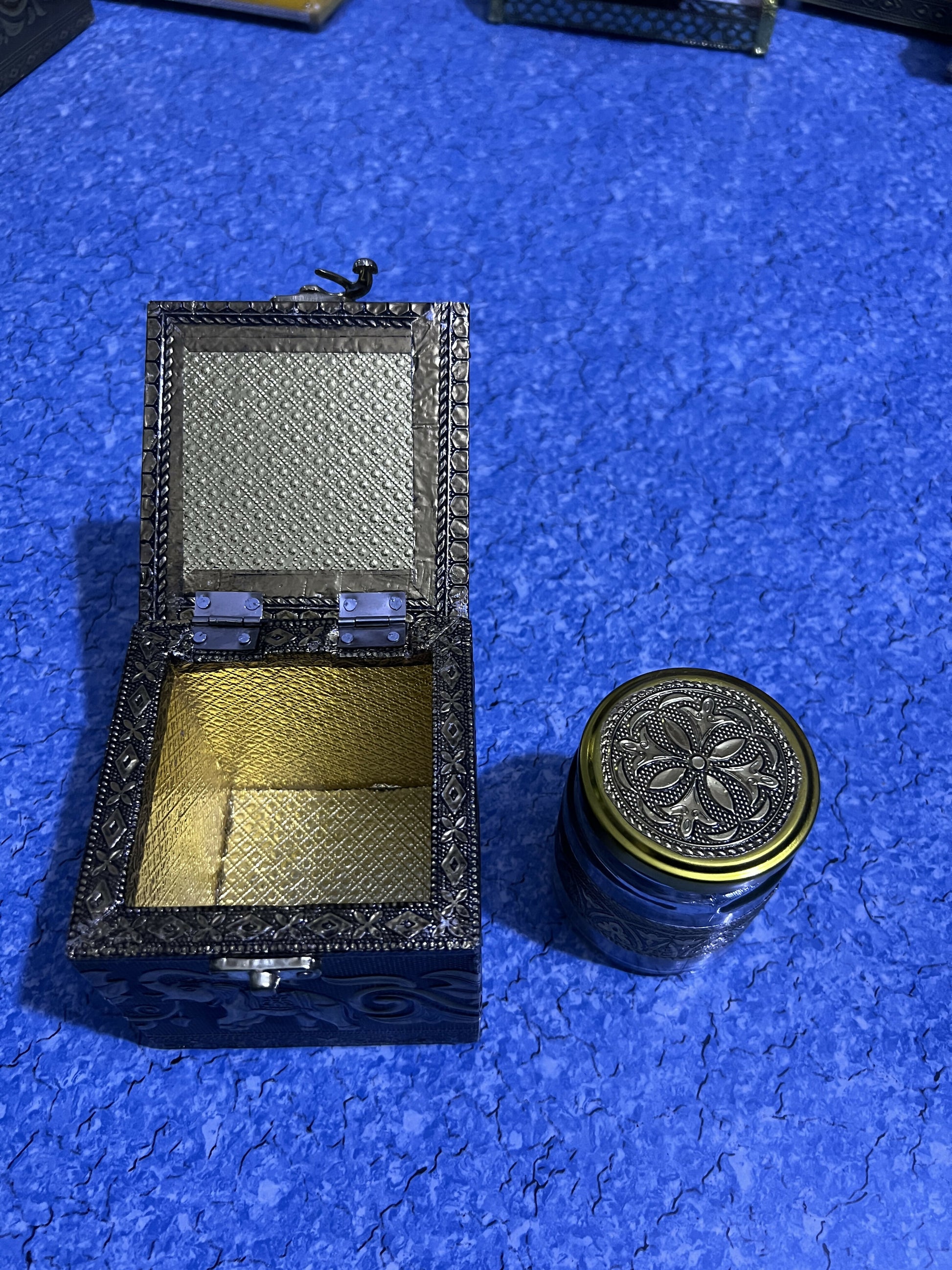 Brass elephant dryfruat box on wooden surface
